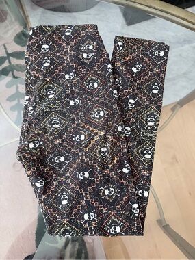 LuLaRoe Black Skull Pattern Leggings with Orange and Yellow Accents